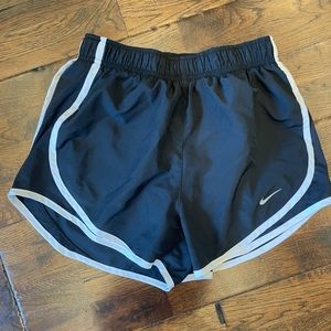 Black Nike running shorts with white trimming size extra small